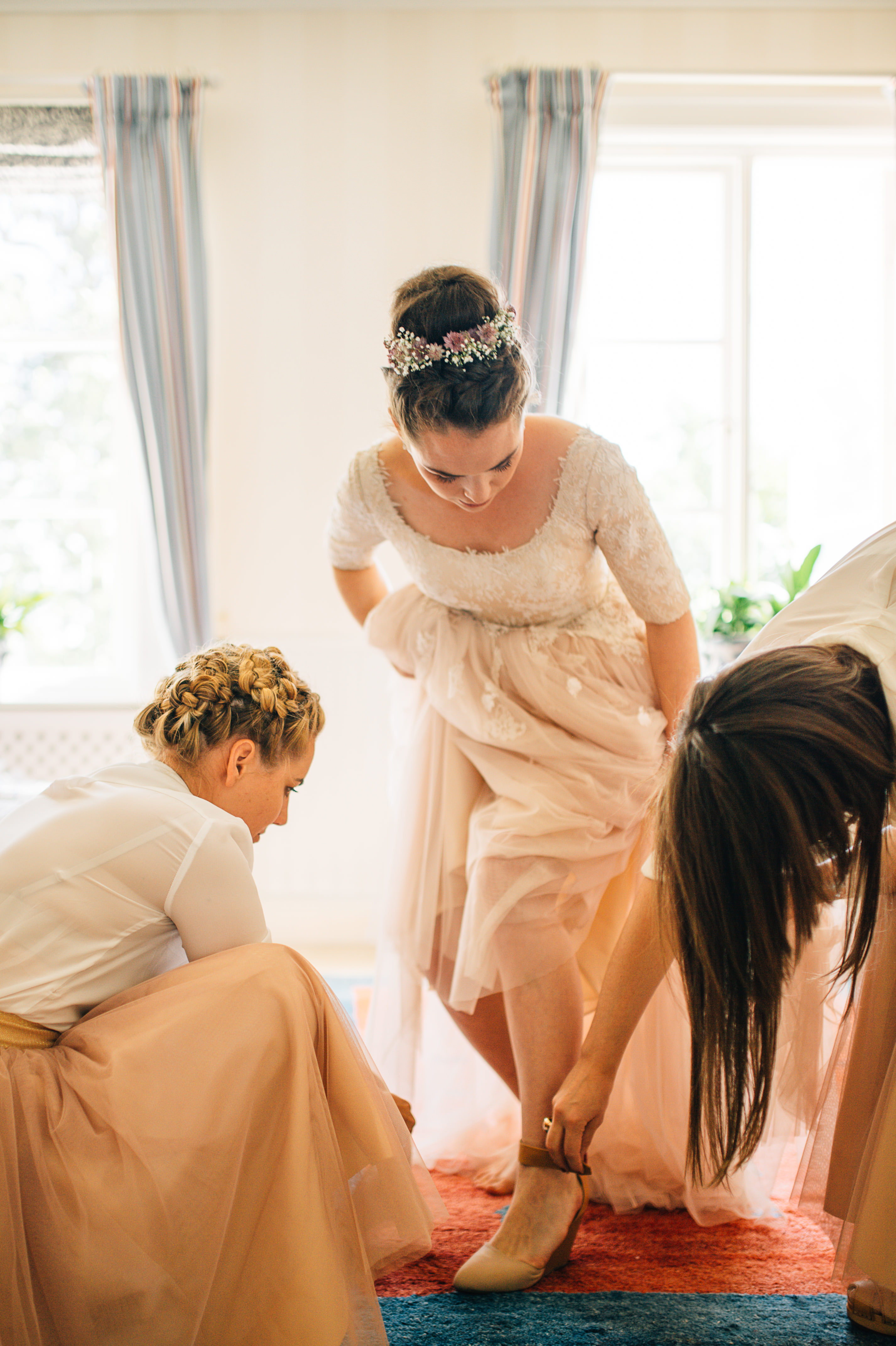 Intimate ceremony moment between bride and groom in Swedish birch forest