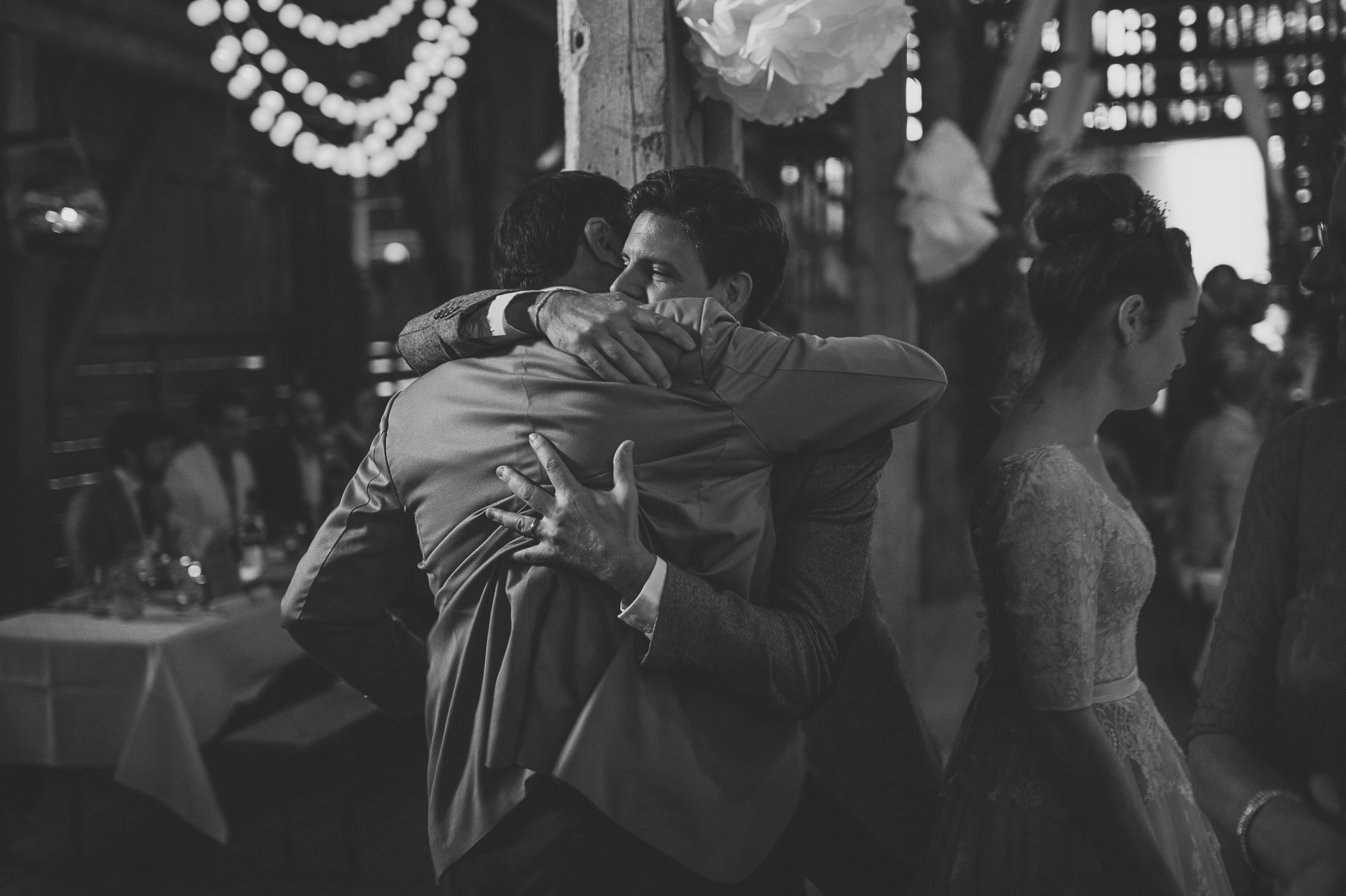 Bride and groom sharing a moment during the barn reception