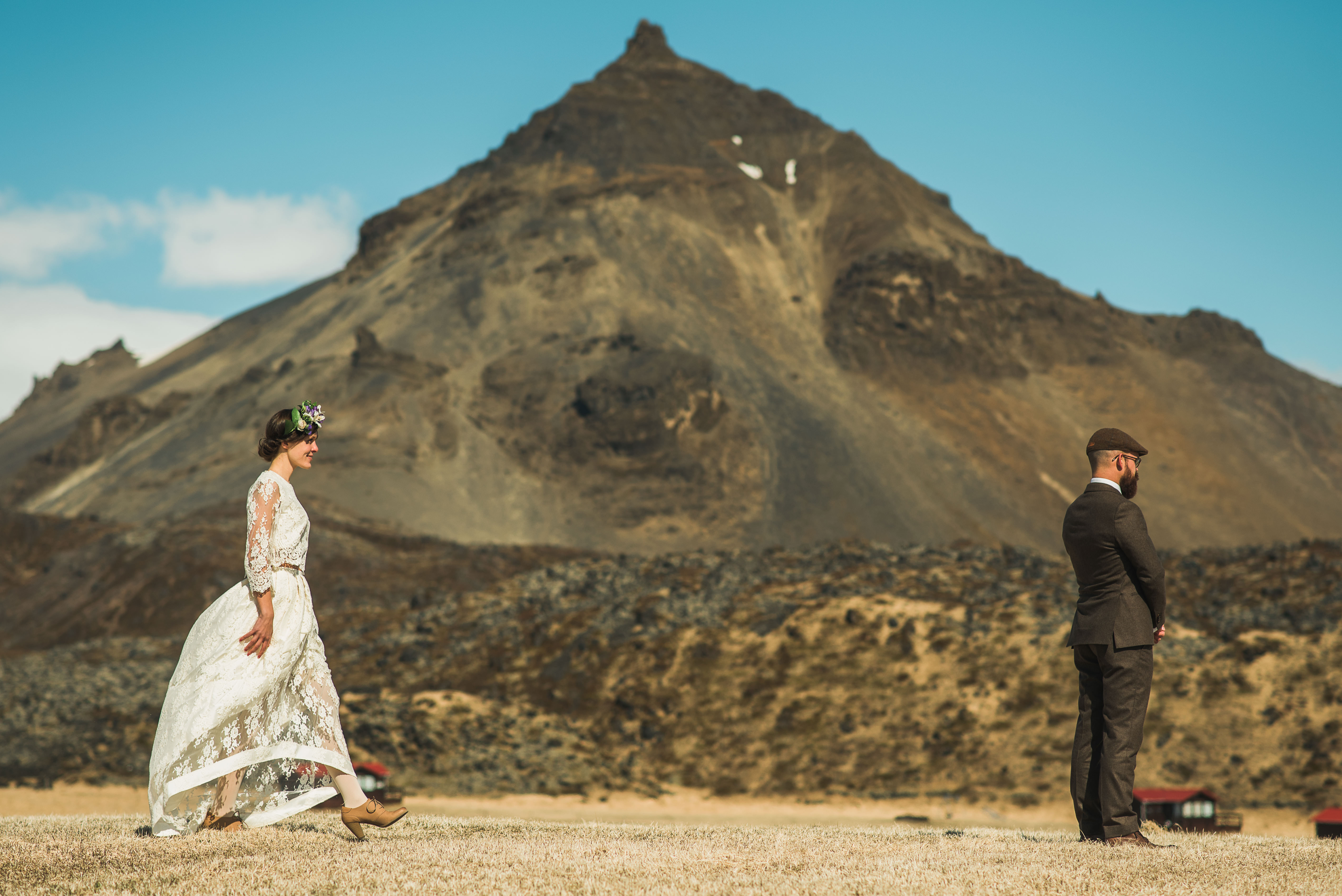 Céline and Ben preparing for their Iceland elopement at Hellnar among Icelandic lava fields