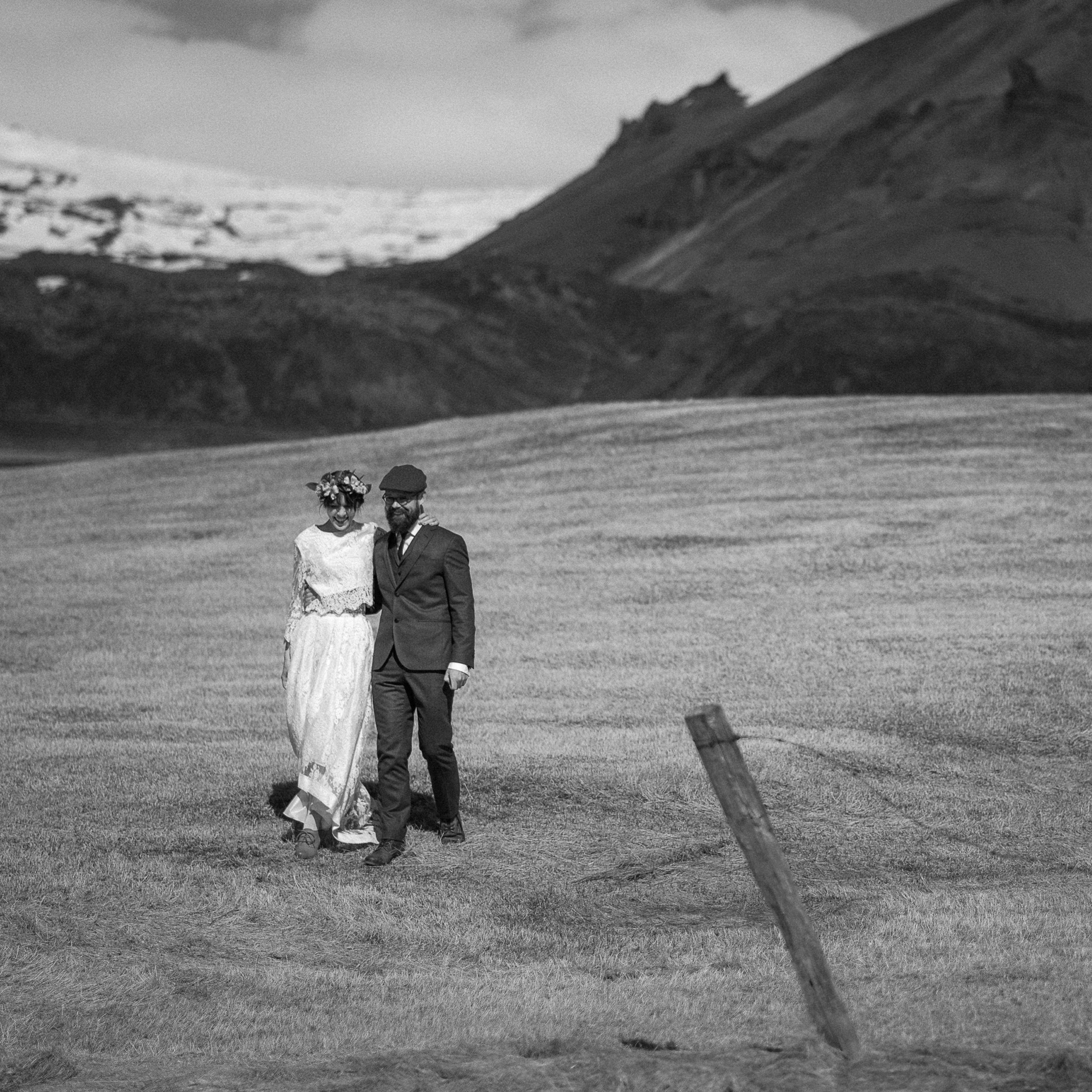 Couple portraits on the rugged Snæfellsnes coastline in Iceland with Snæfellsjökull glacier backdrop