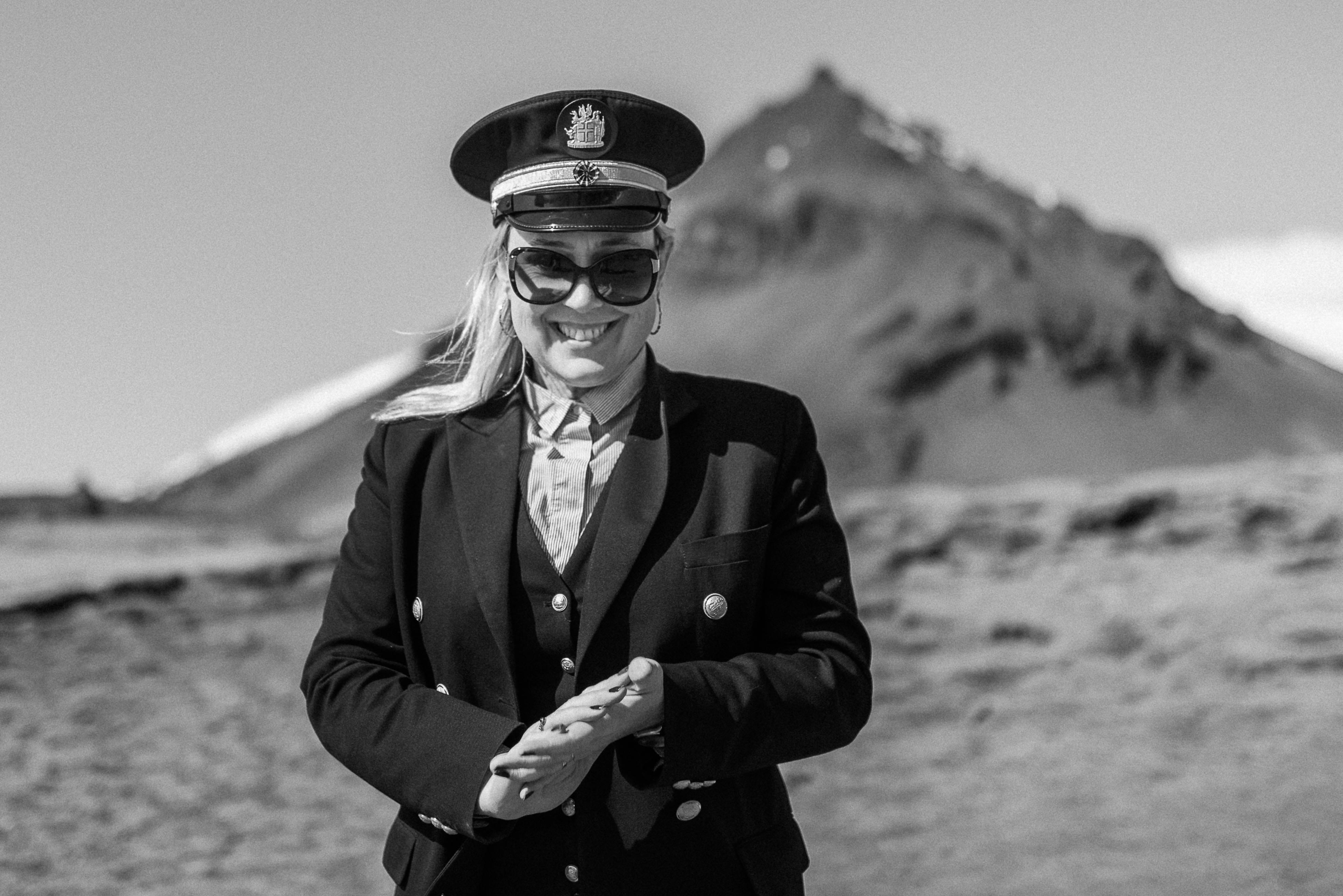 Céline wearing her wildflower crown during their Iceland elopement among Icelandic lava fields