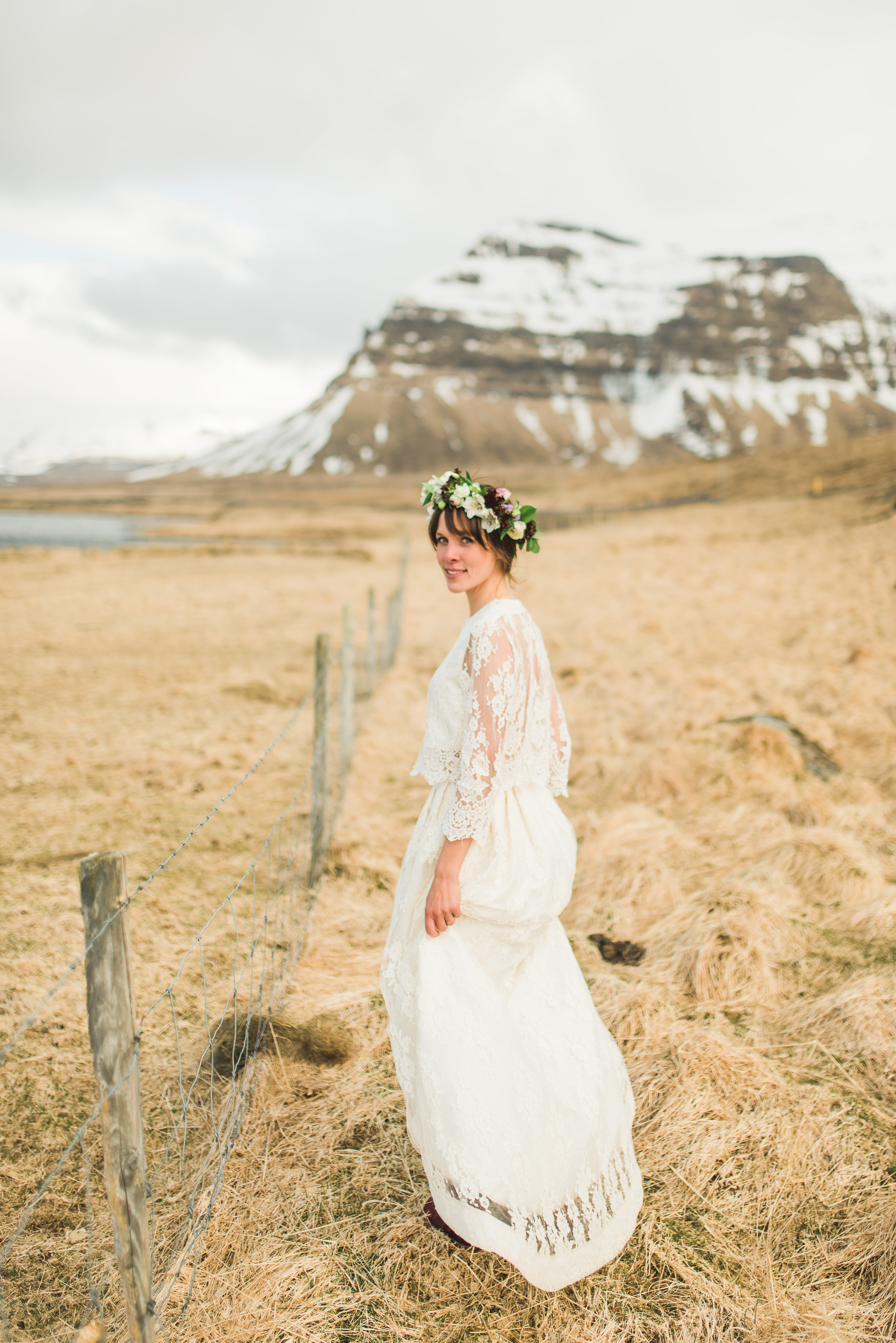 Coastal cliff portraits during Céline and Ben elopement in Iceland with dramatic Icelandic sky