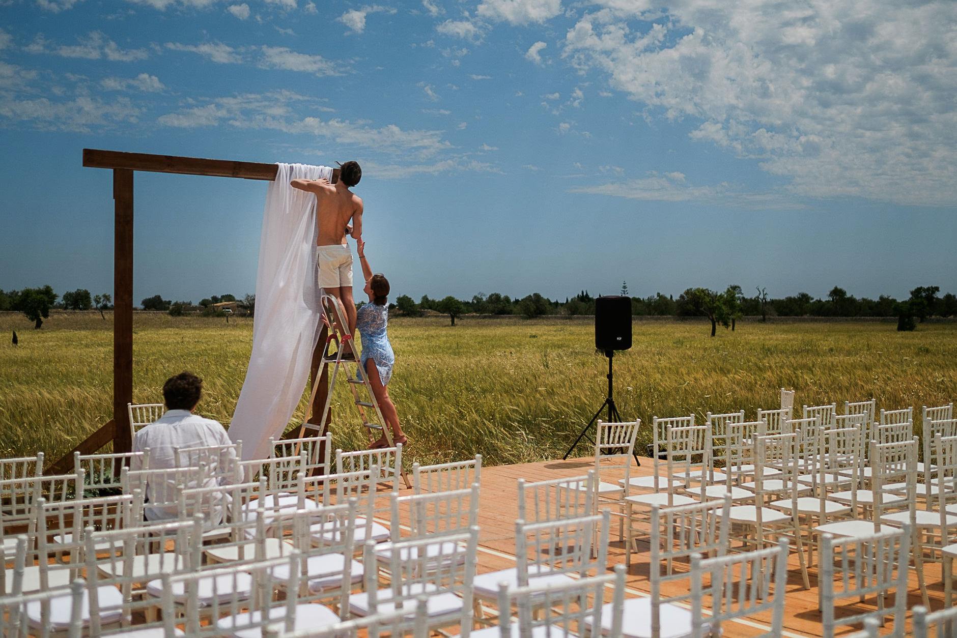 Ceremony set up in a field with chairs and an arch, Mallorca wedding