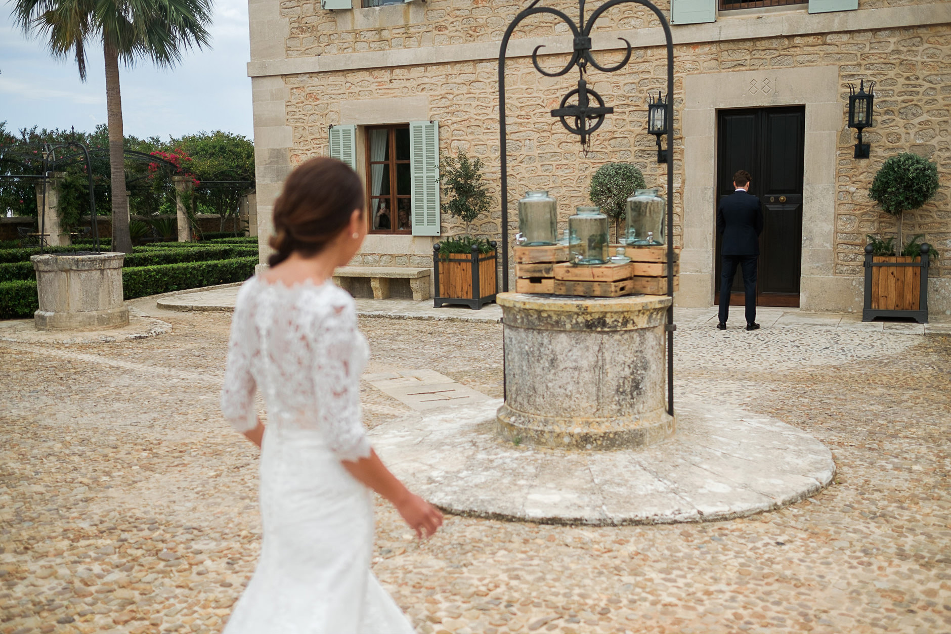 Bride crossing the finca courtyard, Mallorca wedding photographer