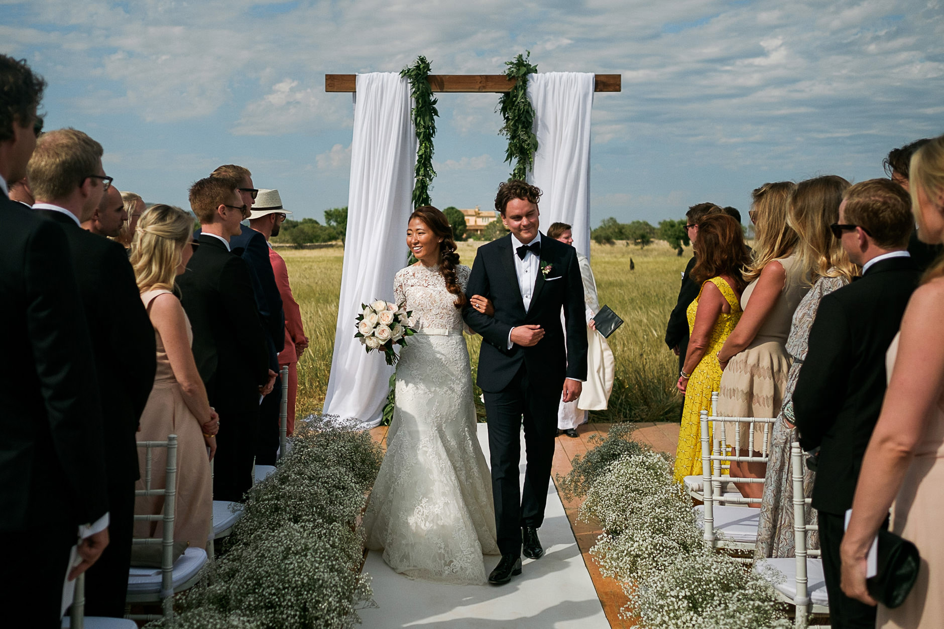 Bride and groom walking back up the aisle, Mallorca wedding