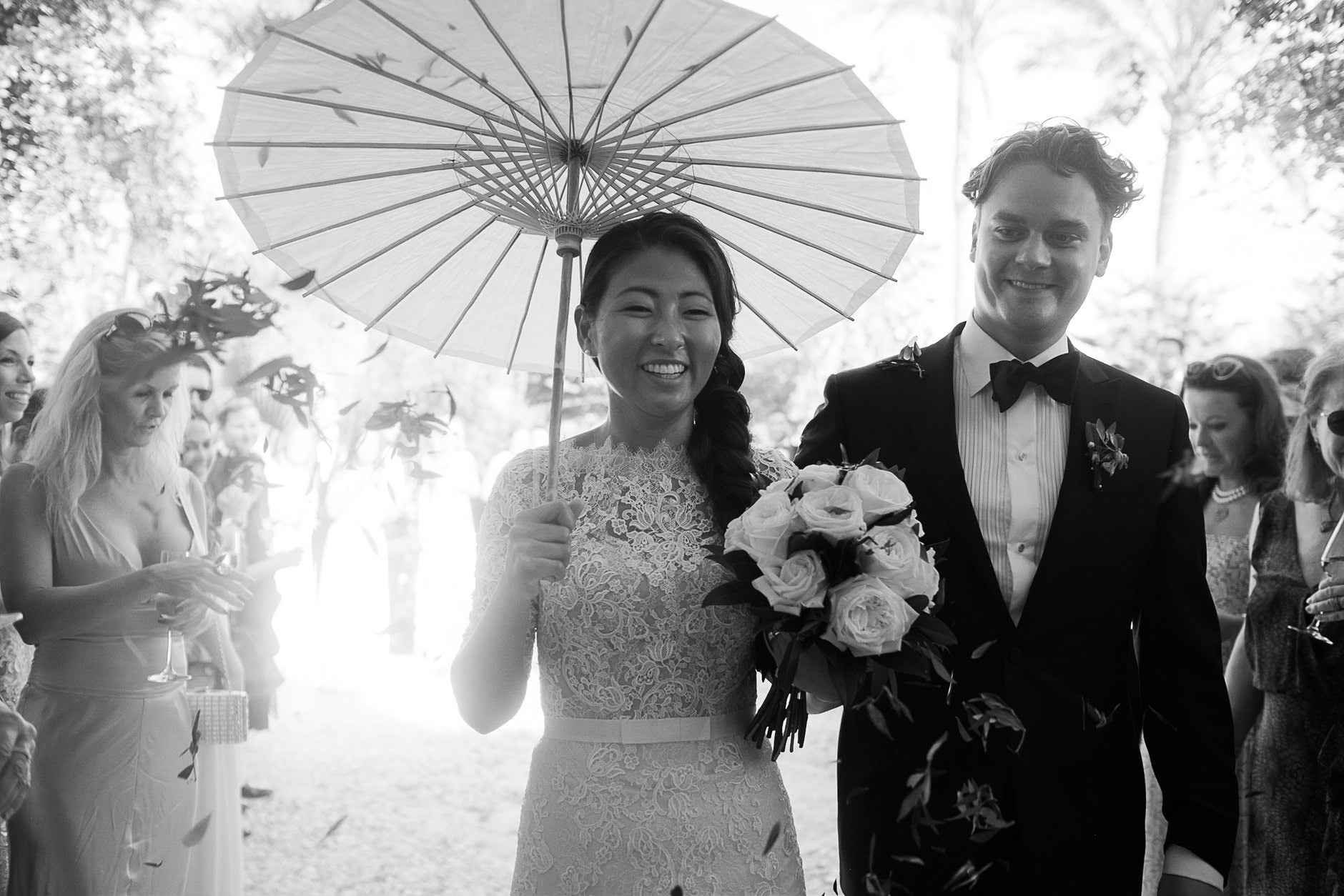 Bride and groom under a parasol, Mallorca wedding