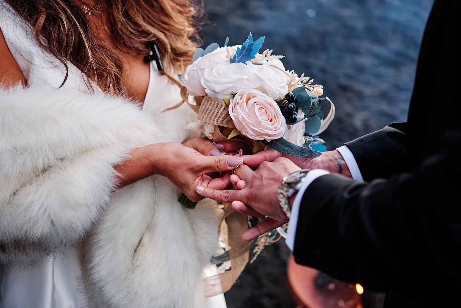 Couple on Reynisfjara beach with Vik sea stacks in background
