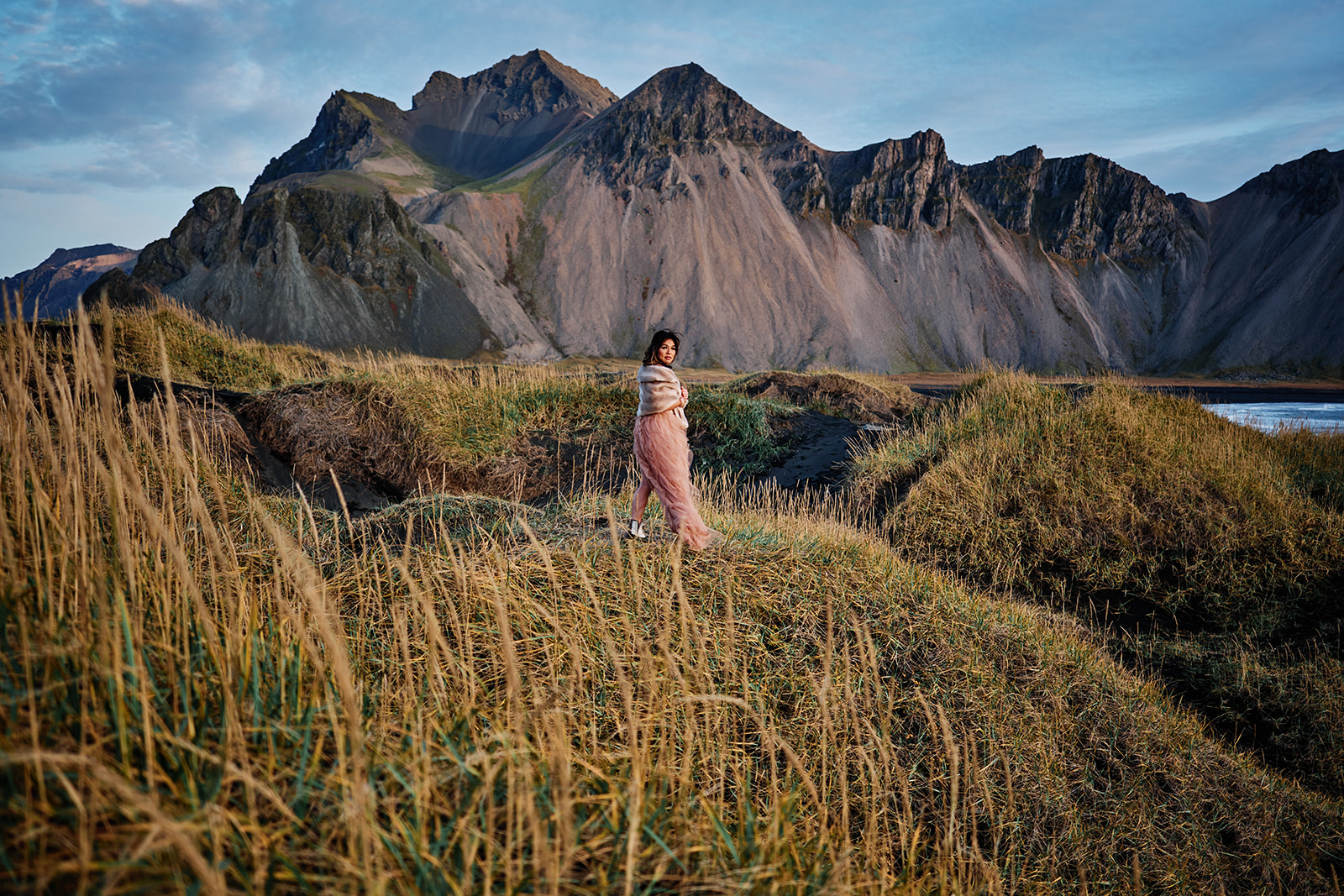 Couple on Stokksnes volcanic sand during Iceland elopement session