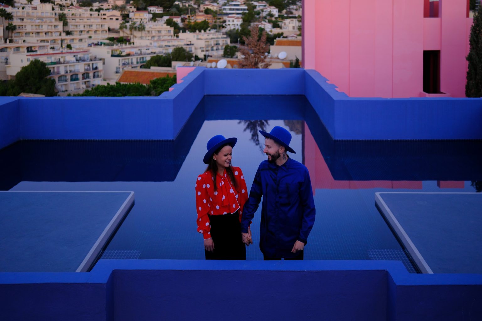 Adriana and Ondrej beside the rooftop pool at La Muralla Roja, Calpe