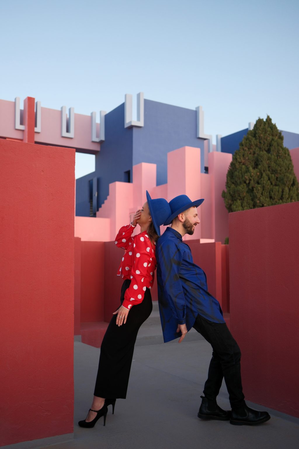 Adriana and Ondrej looking up at the architecture of La Muralla Roja