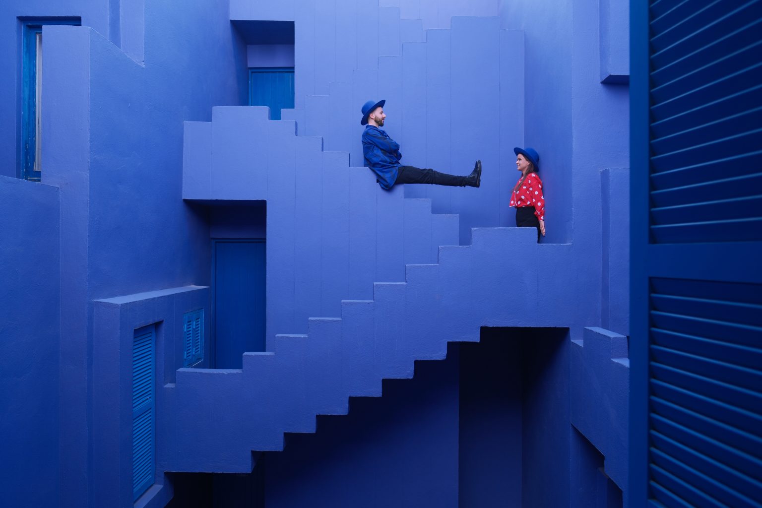 Red against blue on the stair blocks of La Muralla Roja