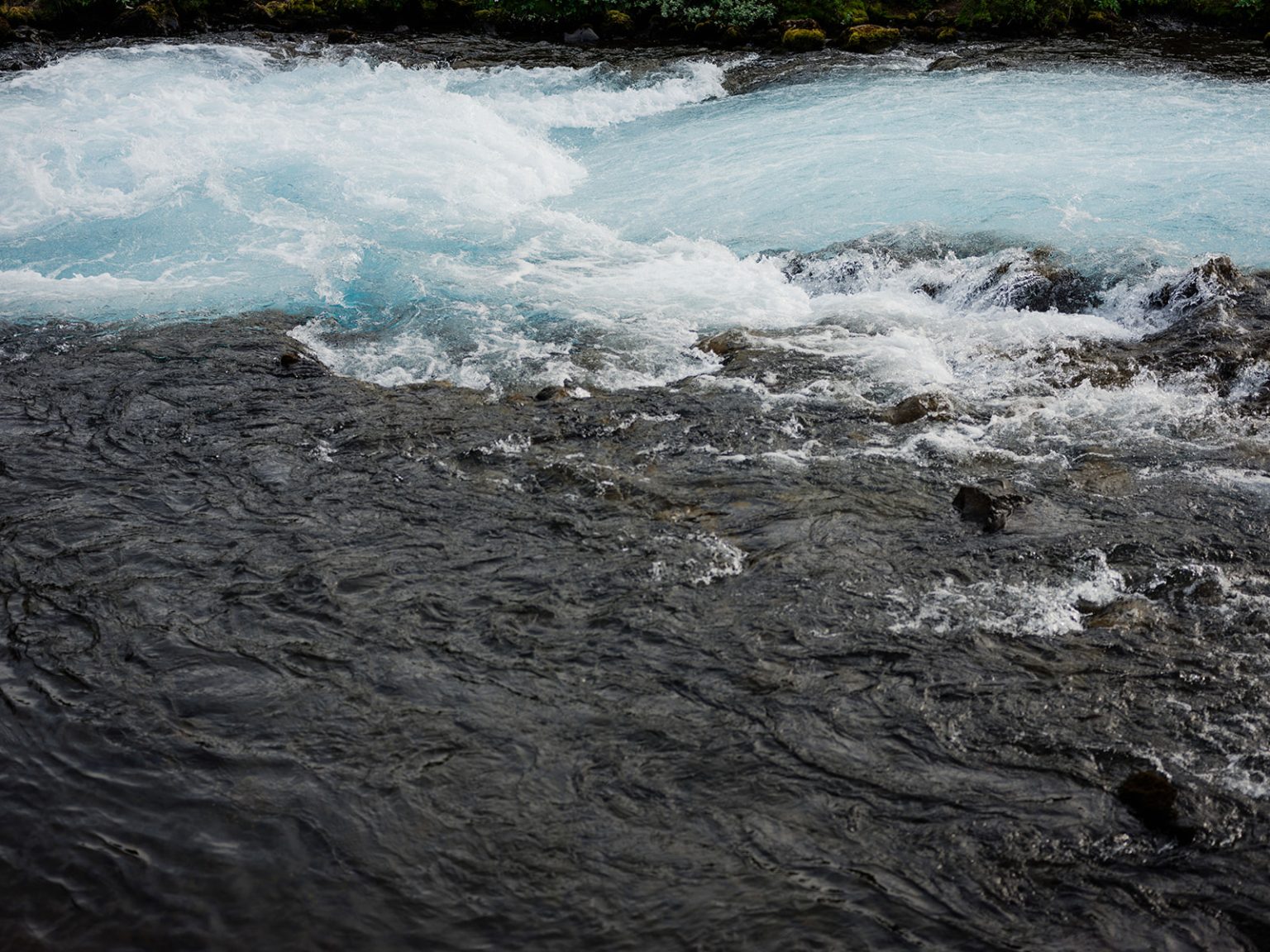 The turquoise water of Brúarfoss in Iceland