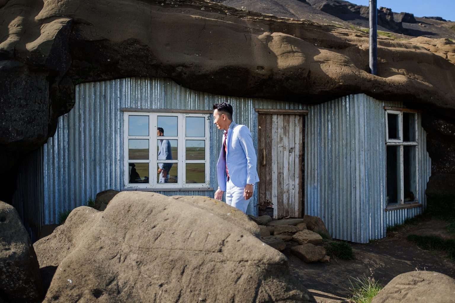 The couple at a turf-roofed cabin in Iceland
