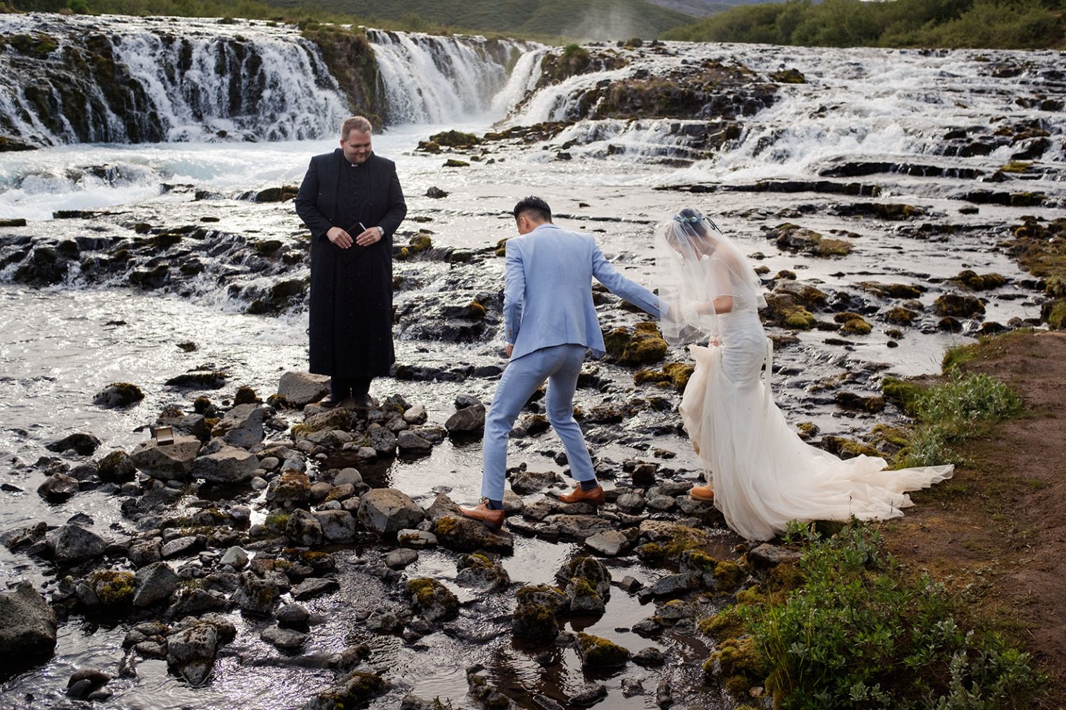 An elopement ceremony at Brúarfoss, Iceland