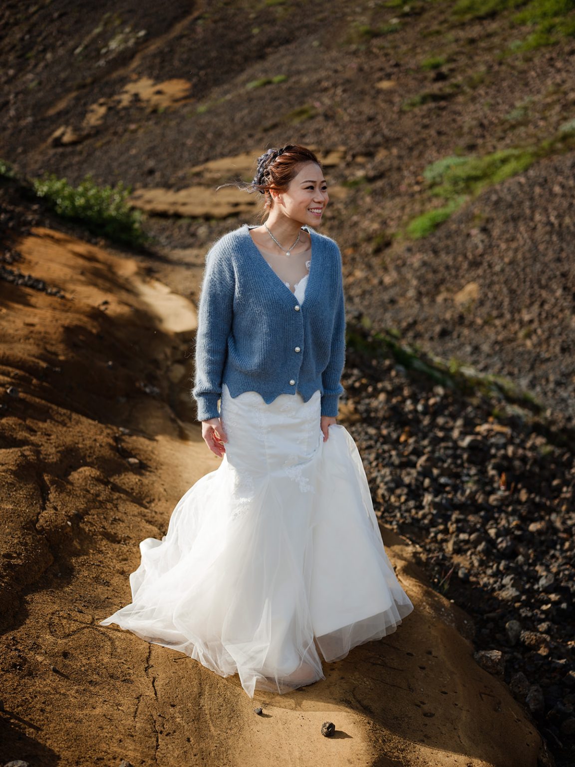 Bride and groom on the volcanic hills of Iceland