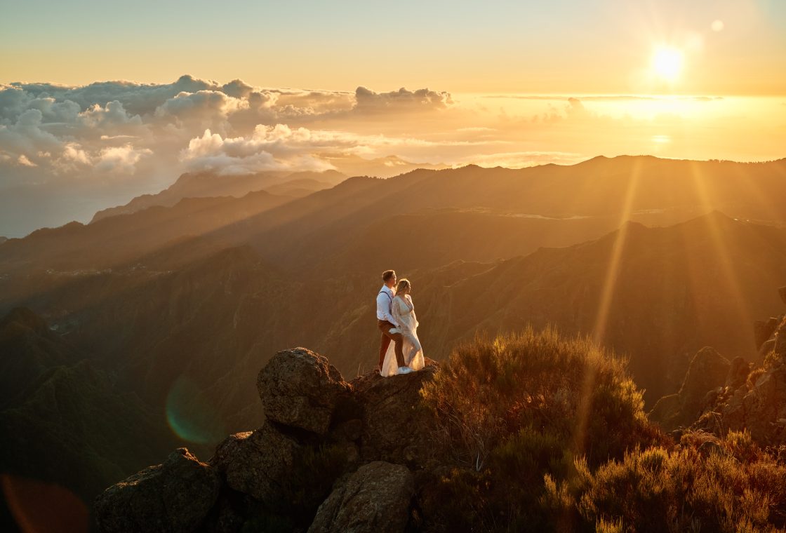 Bride and groom on the ridge at sunrise above the clouds, Pico do Arieiro, Madeira