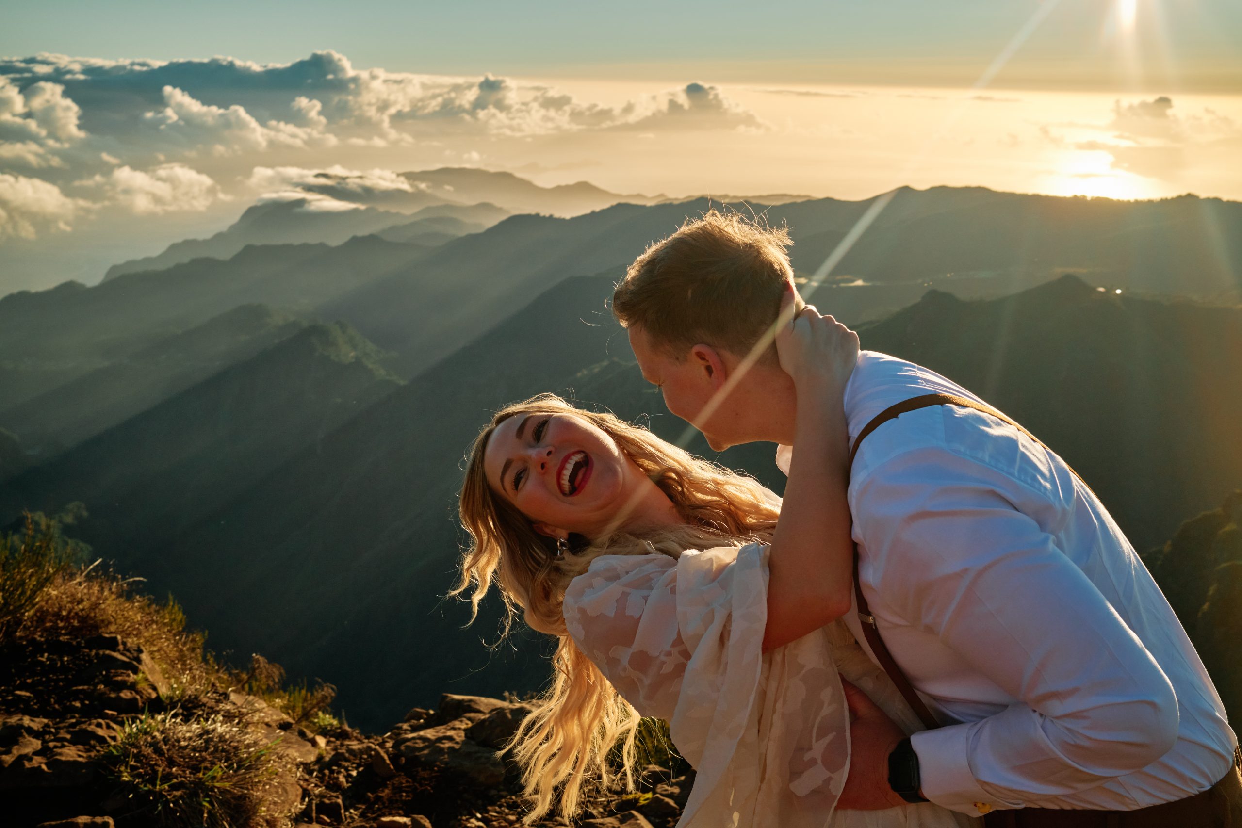 Bride and groom kissing in the sunrise light on Pico do Arieiro, Madeira