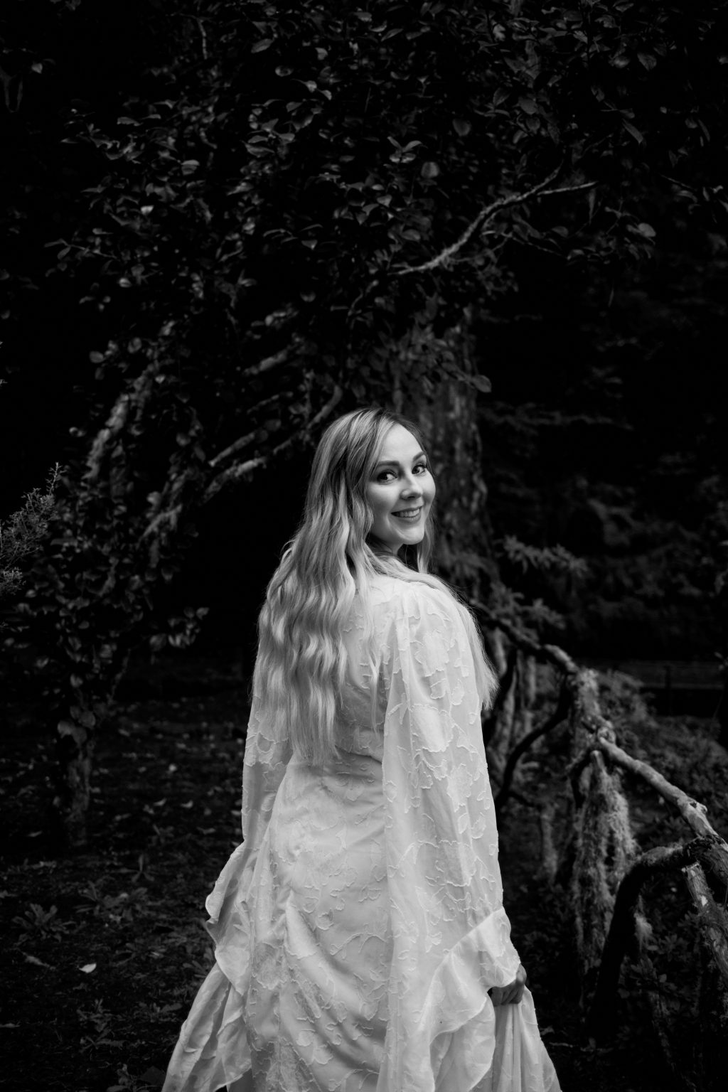 Bride among the old laurels of the Queimadas forest, black and white, Madeira