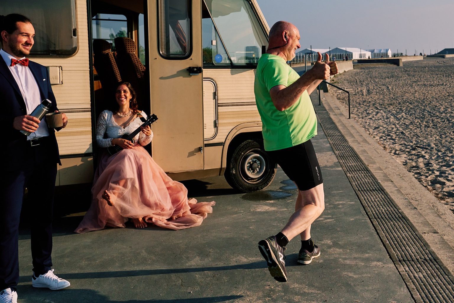 Irene and Jan beside the caravan as a morning jogger passes, Copenhagen