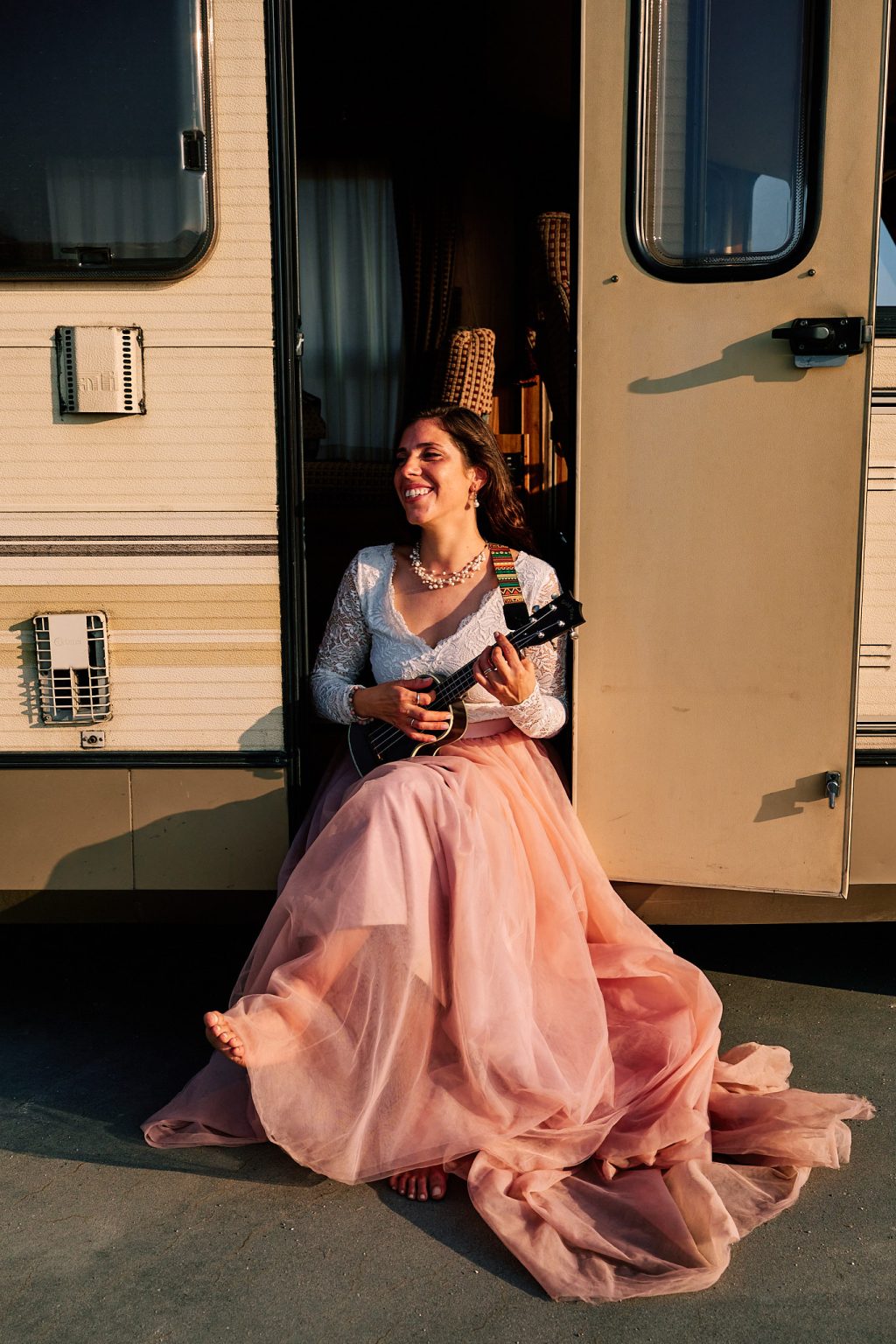 Irene playing ukulele in her pink dress during the Copenhagen session