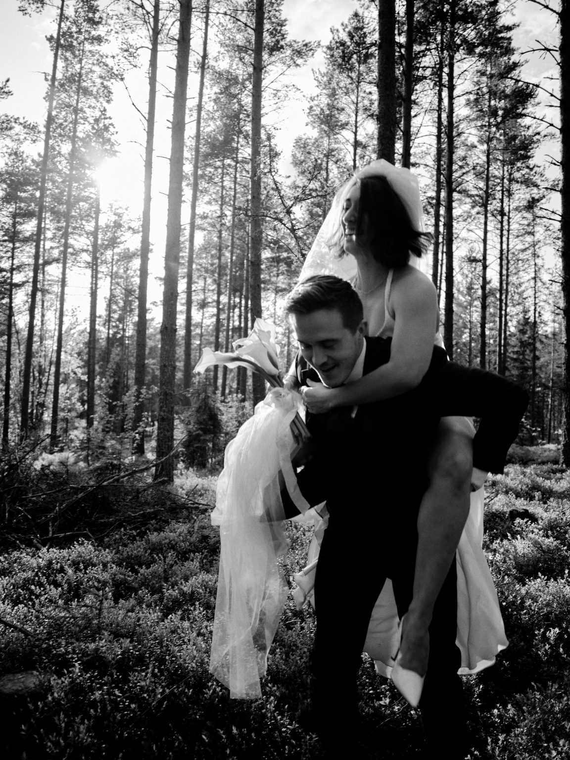 Black and white piggyback ride through the forest