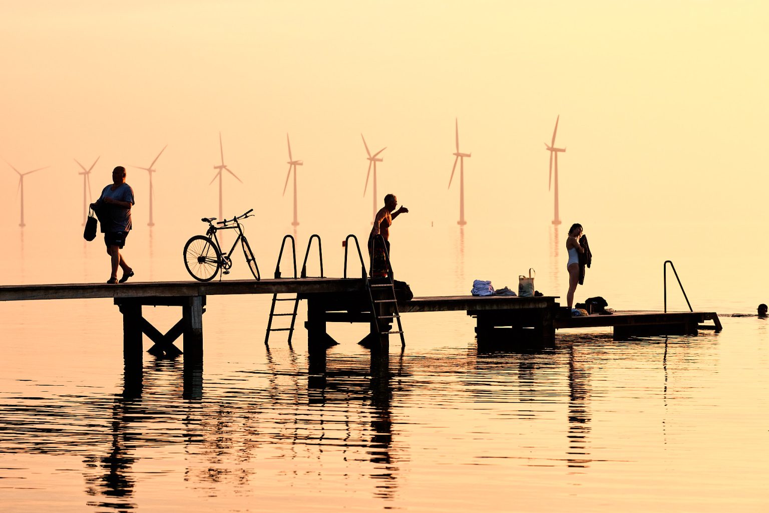 The jetty at golden hour after an early Copenhagen elopement session