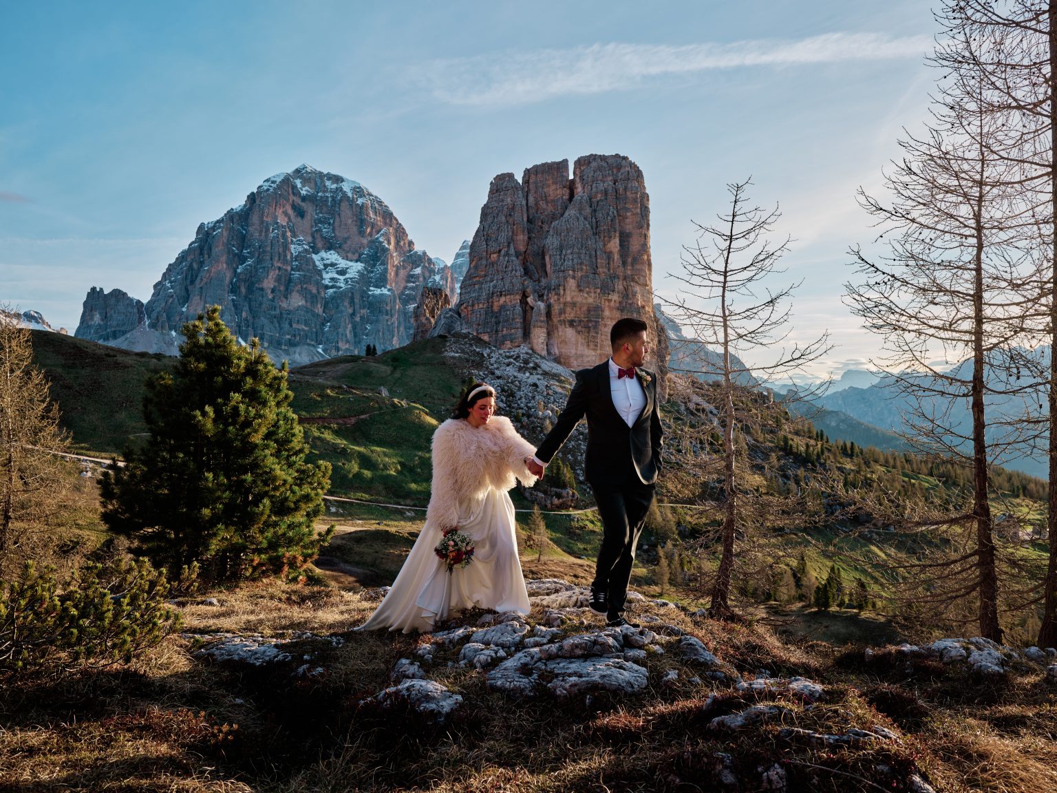 The Cinque Torri rock towers and golden larches at sunrise in the Dolomites, Italy