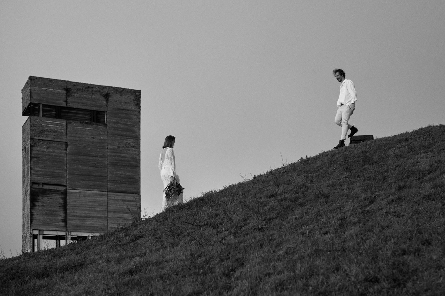 The couple beside a wooden lookout on the hills of São Miguel