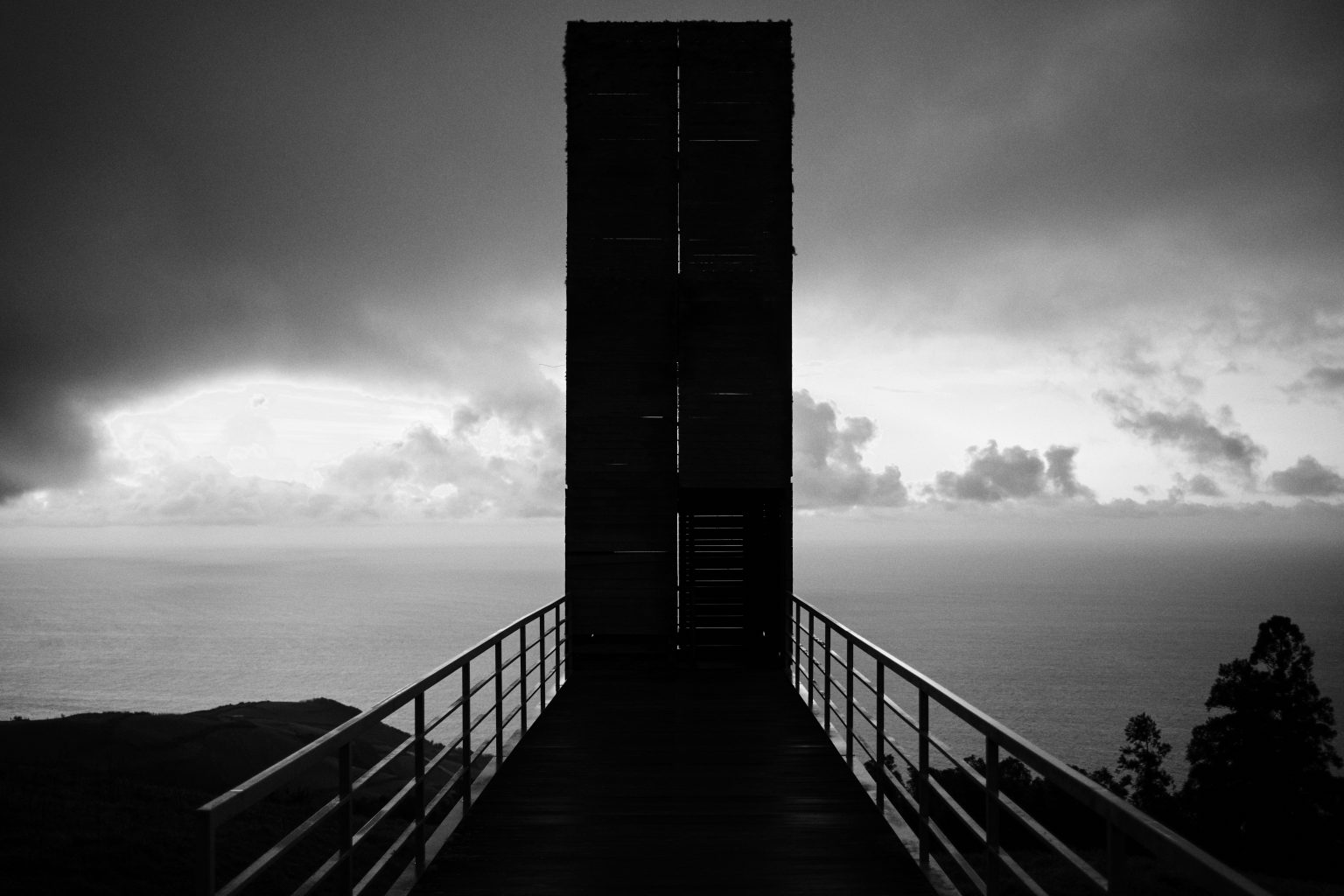 The wooden whale lookout on São Miguel under a heavy Atlantic sky