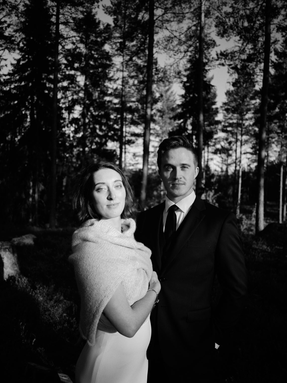 Sara in a shawl with Martin, black and white portrait in the forest