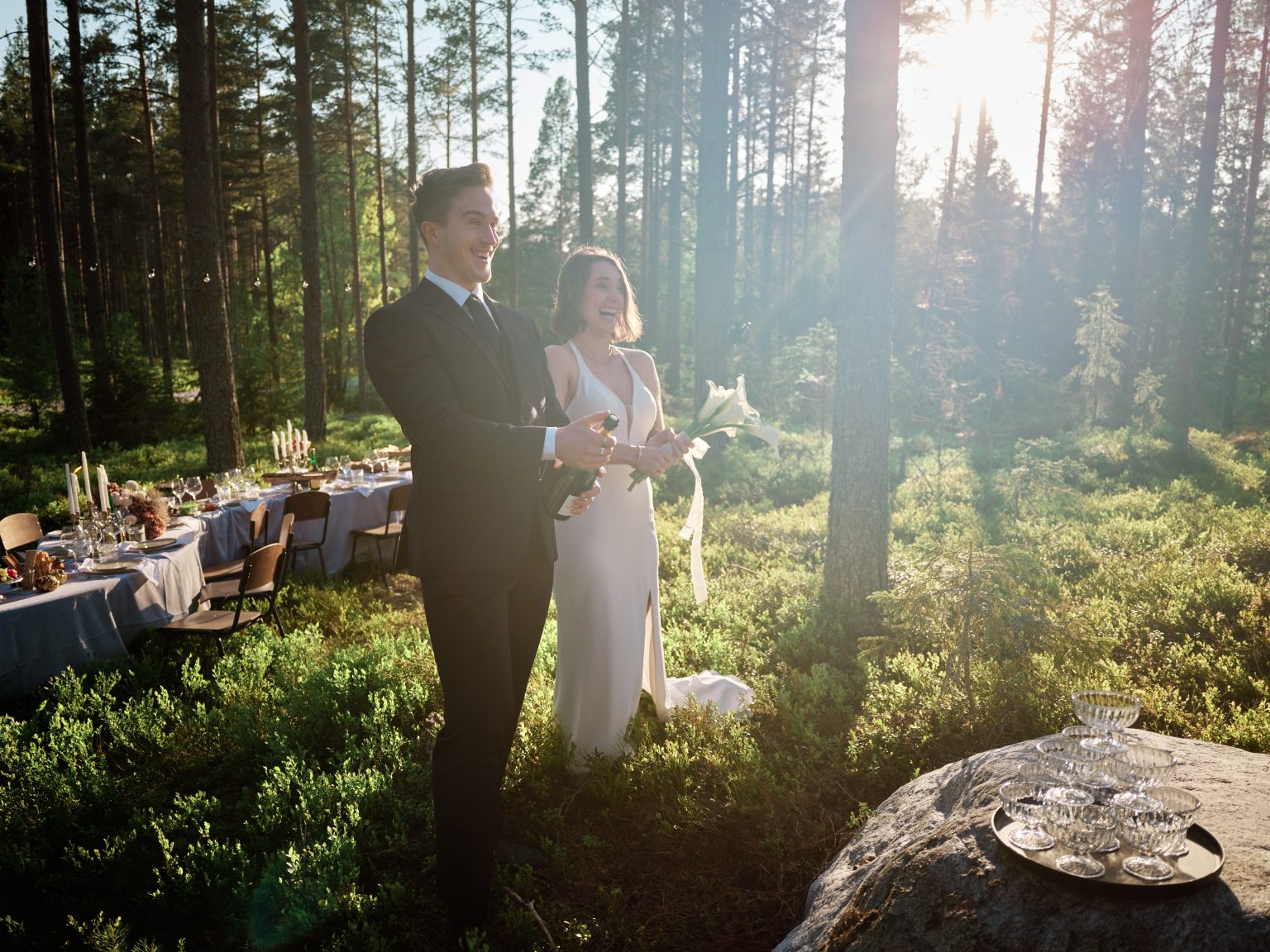 Sara and Martin on a boulder in golden evening light