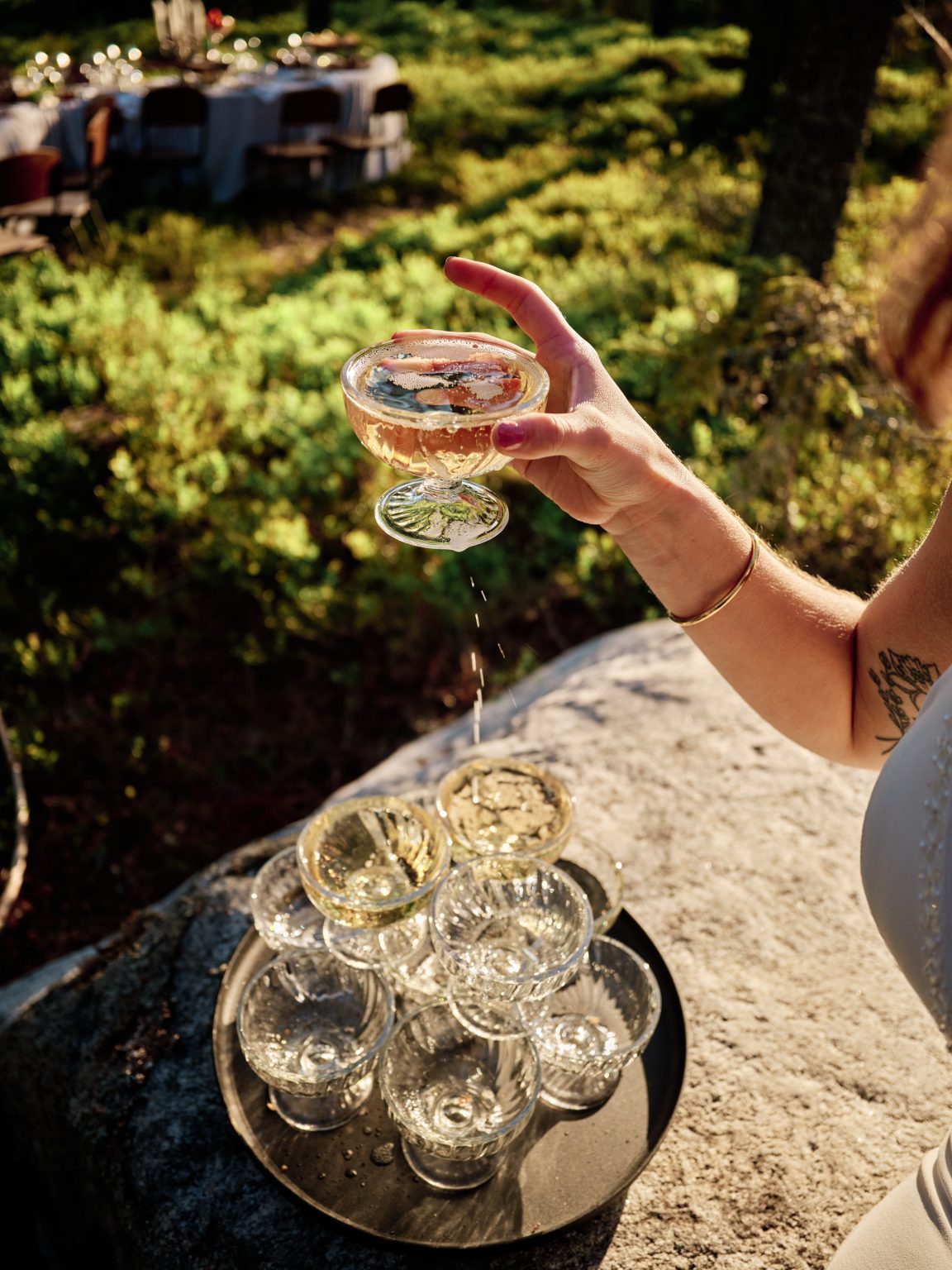 A champagne coupe filled over the stone, Swedish midsummer light