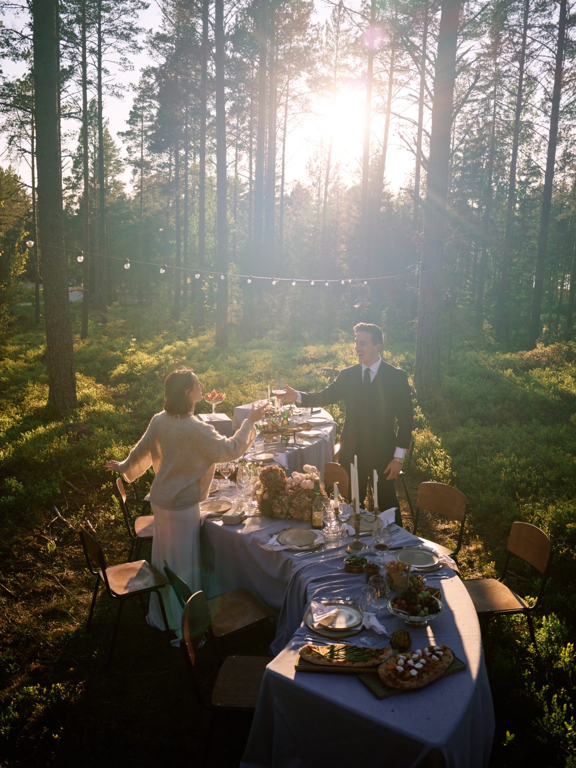 Golden hour at the dinner table in the forest at Hop Farm Beach