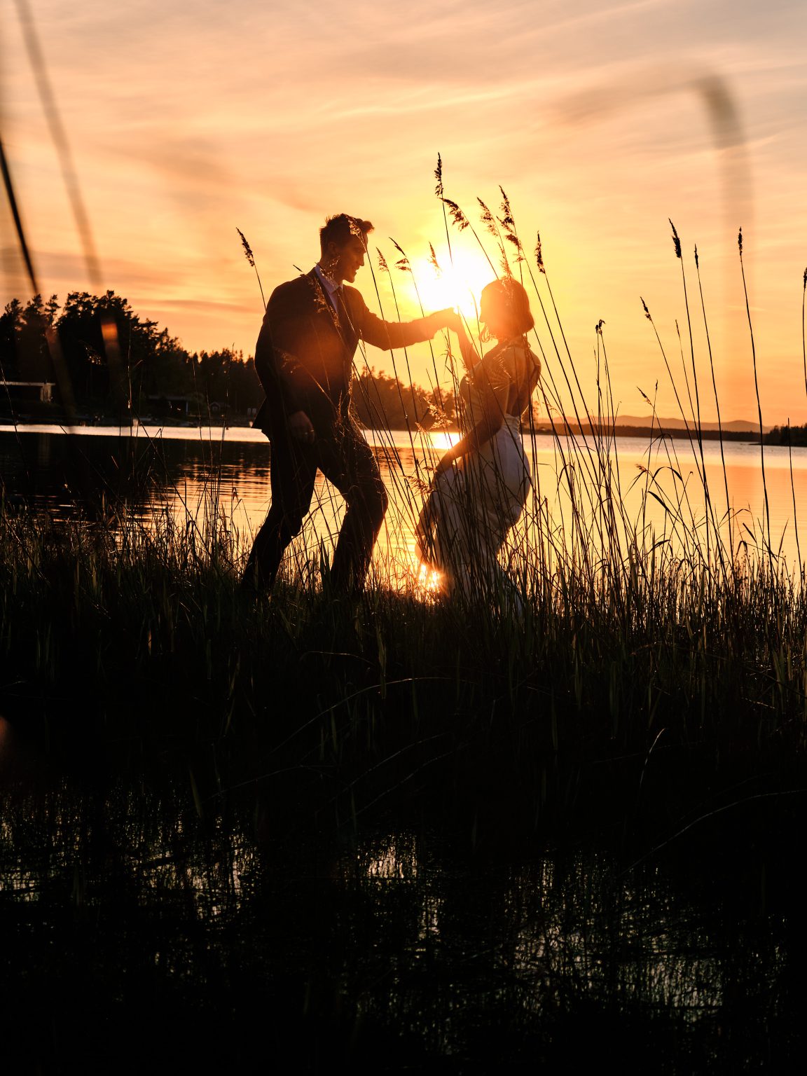 Dancing through the reeds with the sun between them
