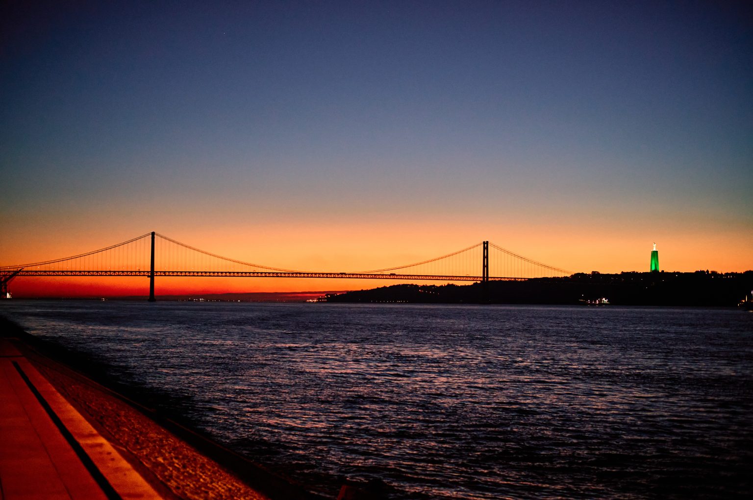 The 25 de Abril bridge over the Tejo river before sunrise in Lisbon