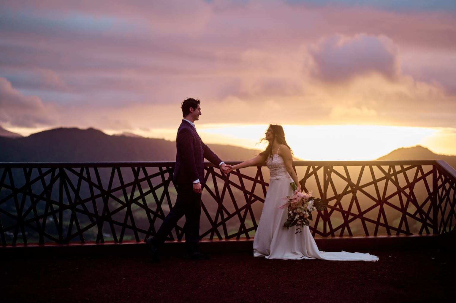Couple at the Salto do Cavalo viewpoint at sunrise, São Miguel, Azores