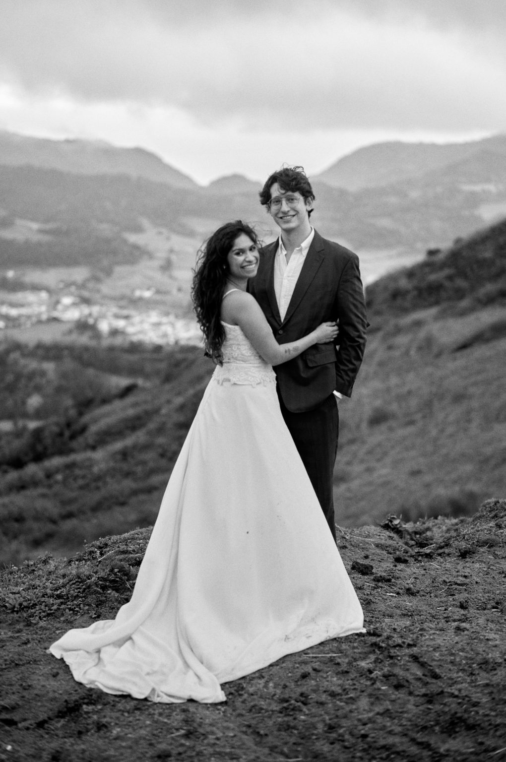 Couple in black and white with the green valley behind, São Miguel, Azores