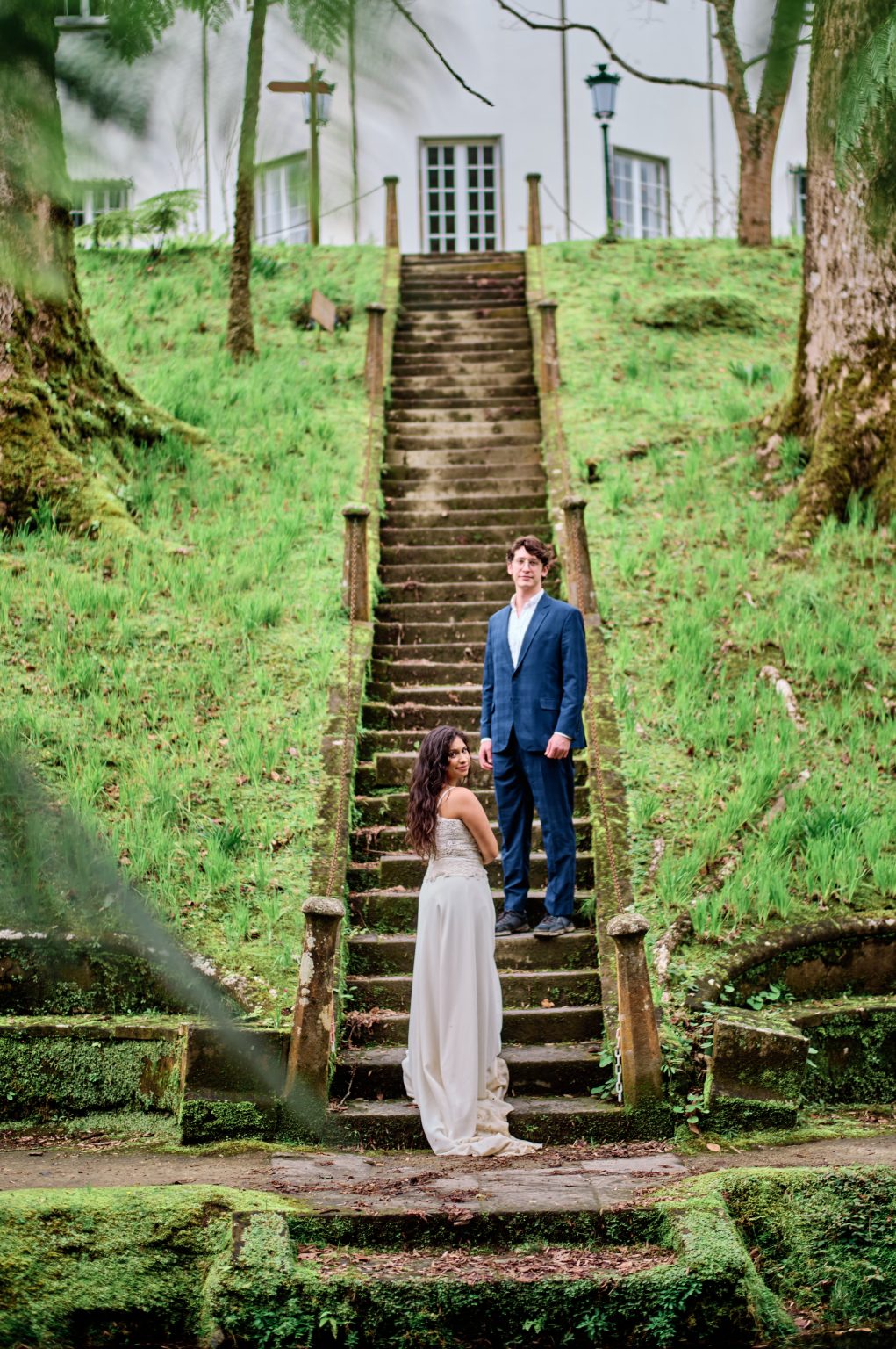 Couple on stone steps in the Terra Nostra gardens, São Miguel, Azores