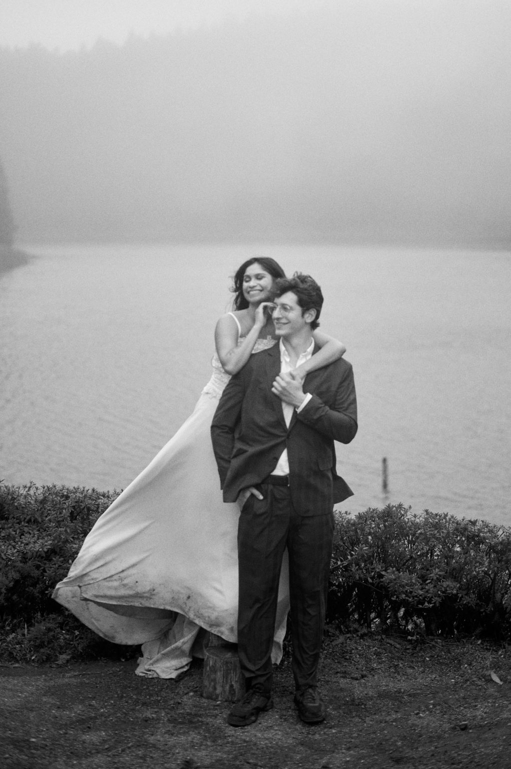Bride and groom laughing, dress in the wind, black and white, São Miguel, Azores