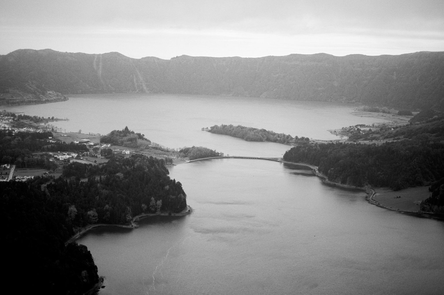 A crater lake seen from above in black and white, São Miguel, Azores