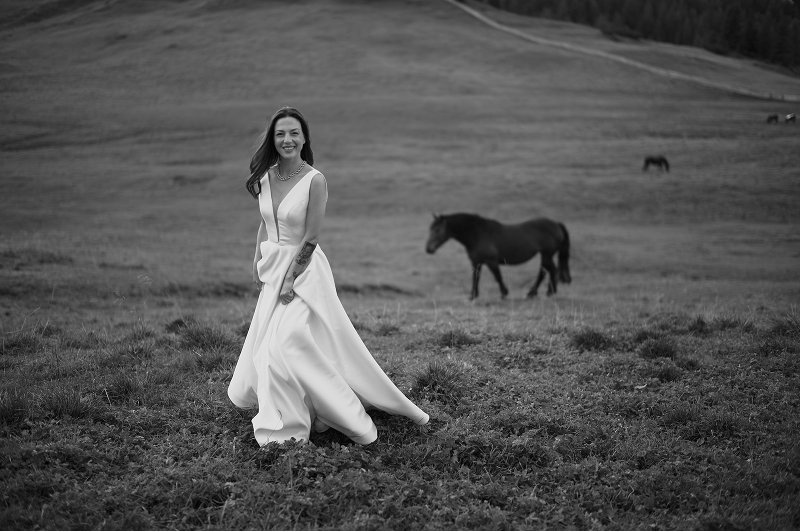 Bride with wild horses at Prato Piazza, Dolomites