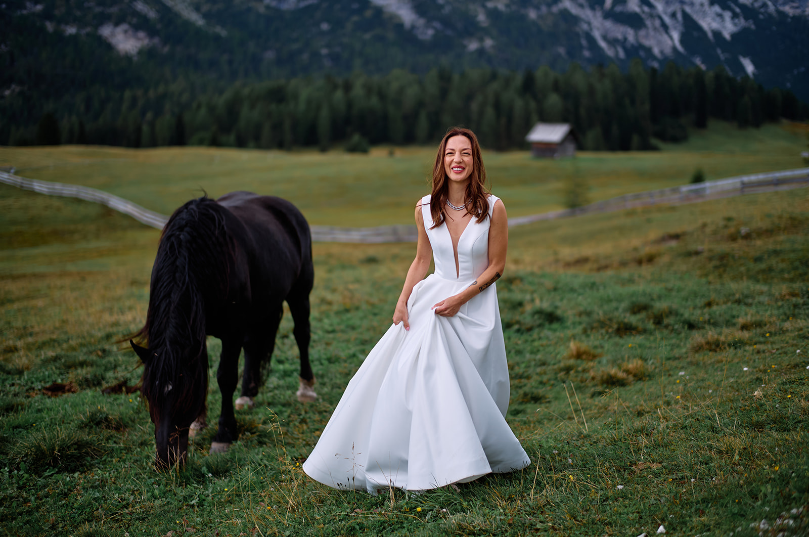 Couple and horses on the Prato Piazza plateau, Dolomites
