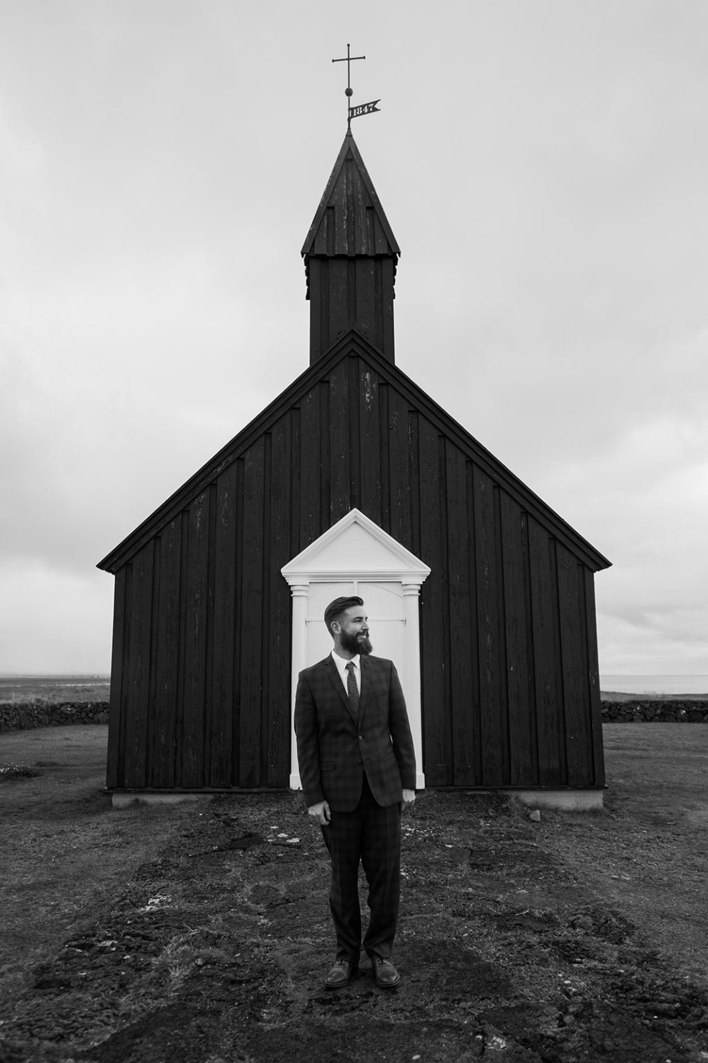 The bride at the door of the black church, Búðir, Iceland