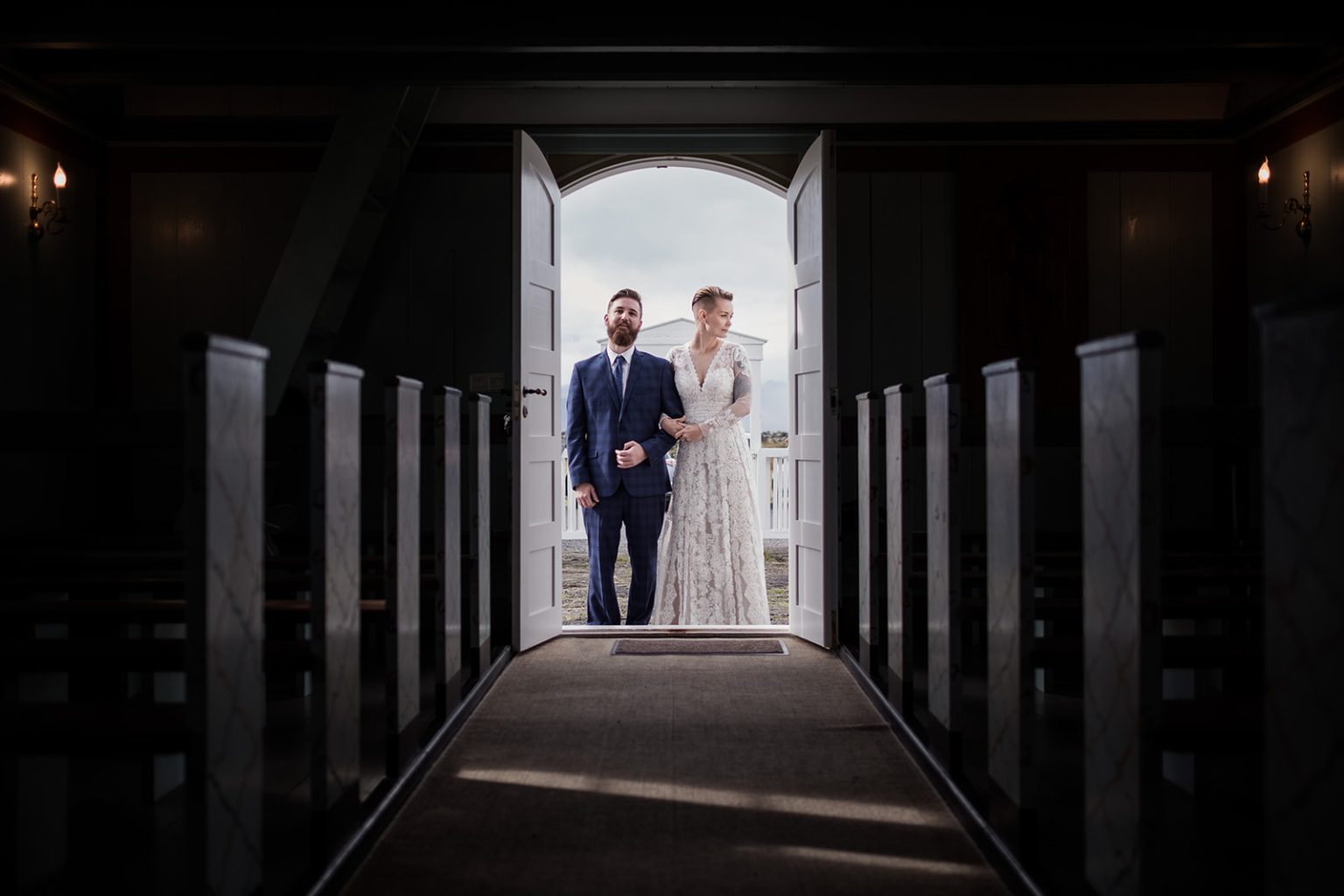 Walking down the aisle in the black church, Búðir, Iceland