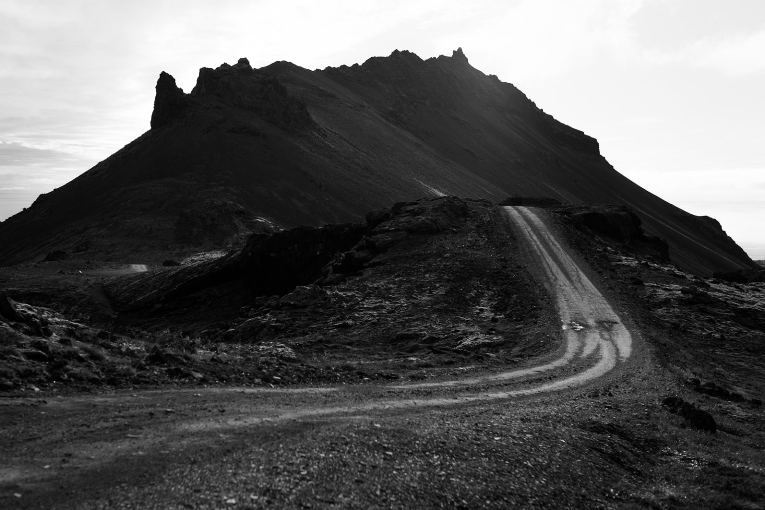 A road across the black lava of Snæfellsnes, a Hótel Búðir wedding photographer