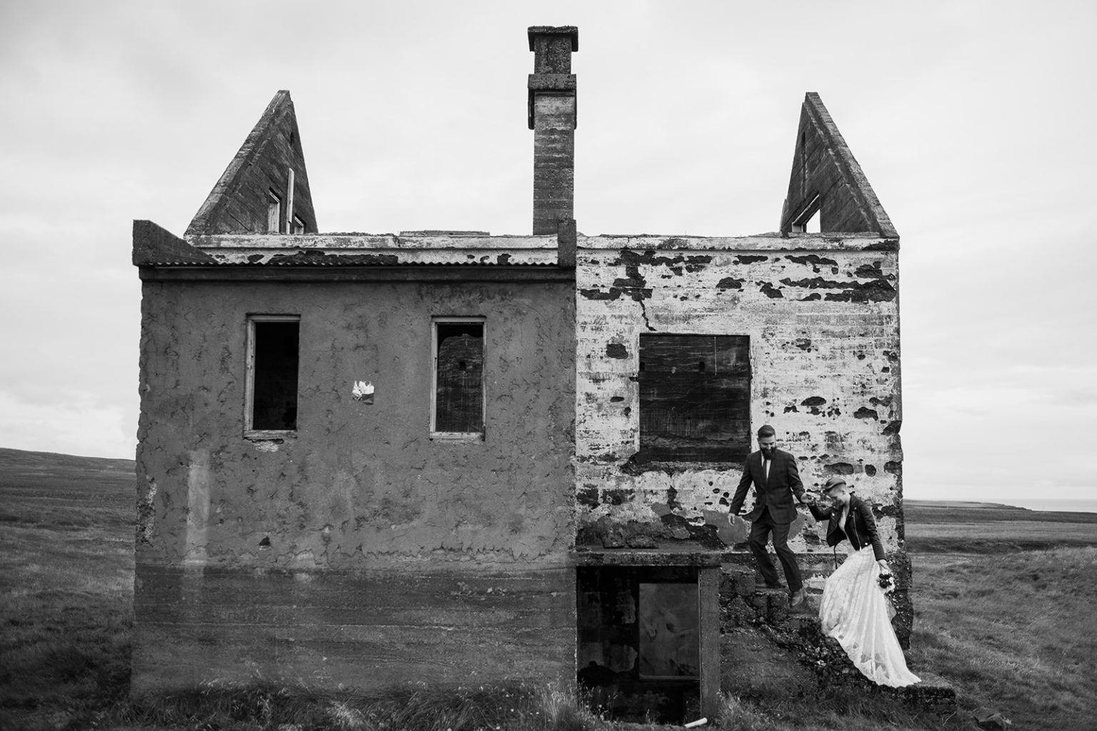 The couple at an abandoned stone ruin, Snæfellsnes, Iceland