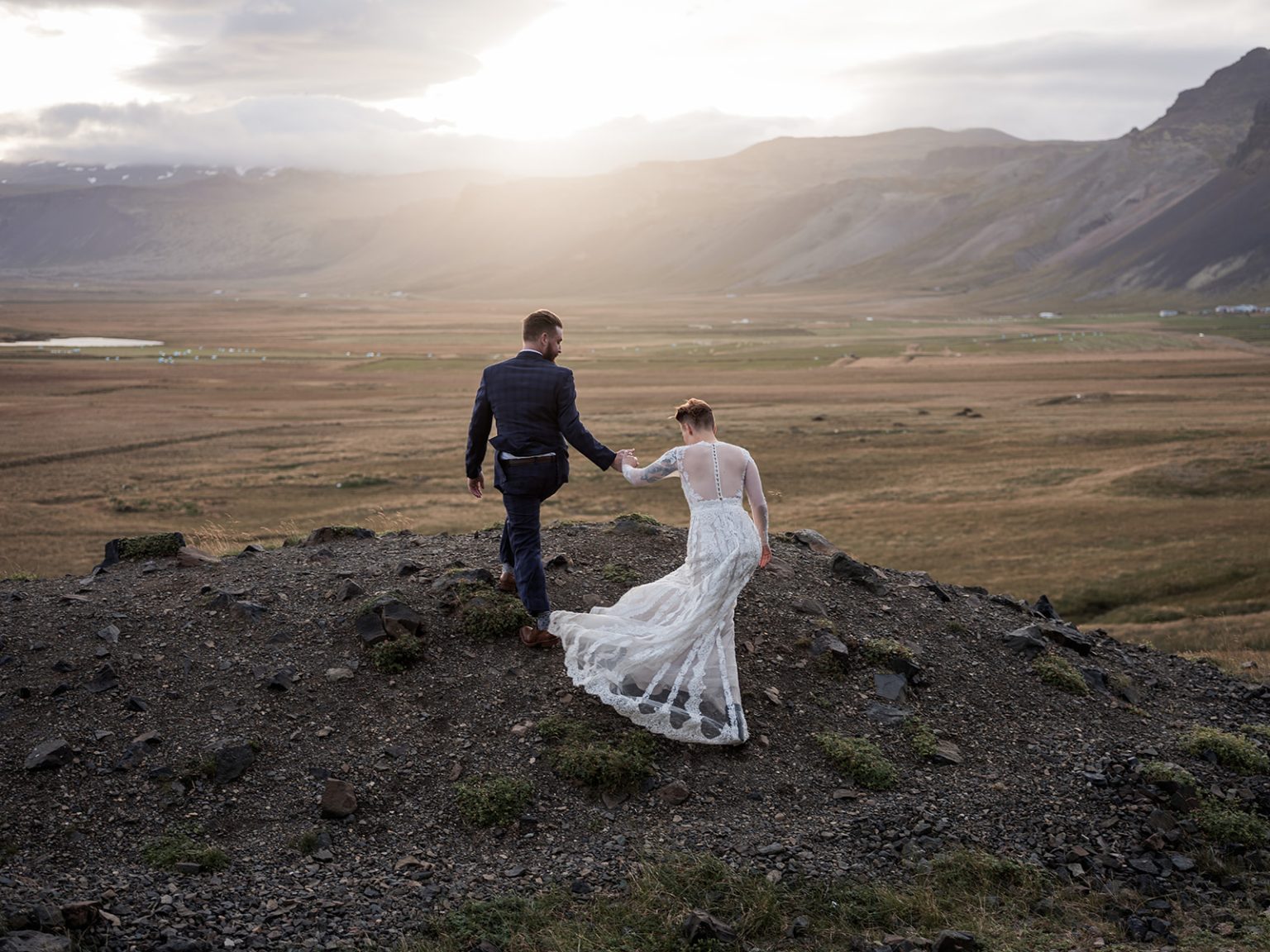 The couple in golden light on the plain, Búðir, Iceland