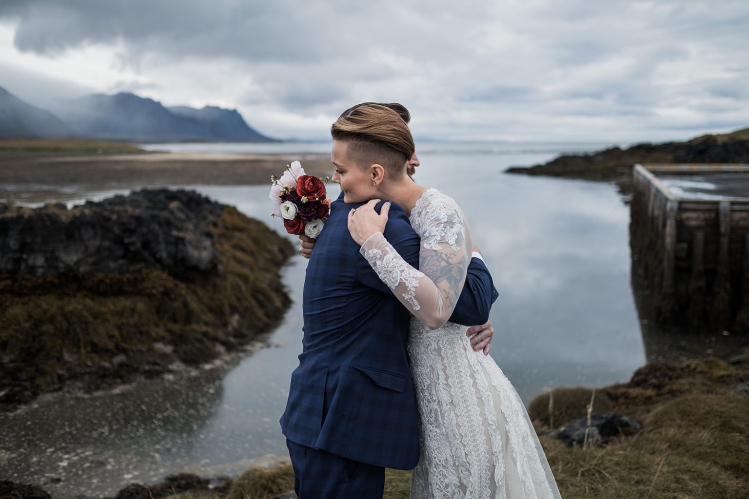 The couple on the mossy coast at Búðir, Iceland