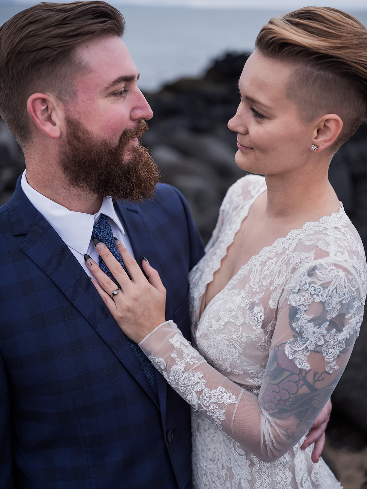 Amelia and Adam close together on the black lava, Búðir, Iceland