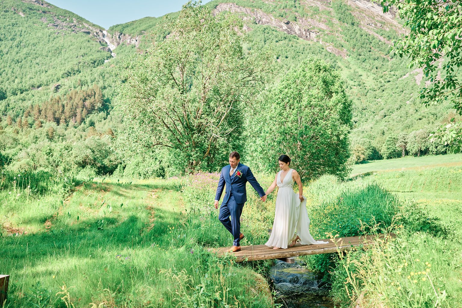 Bride and groom by the river at Juvet